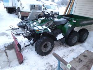 lot 3 image: 1997 Polaris Magnum 6X6 ATV with Plow