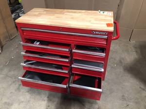 lot 21 image: Husky 42 in. W x 18.1 in. D 8-Drawer Red Mobile Workbench Cabinet with Solid Wood Top, Review all pictures
