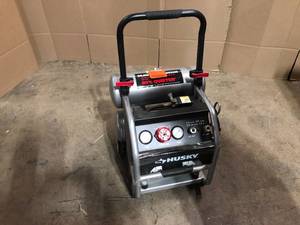 lot 31 image: Husky 4.5 Gal. Portable Electric-Powered Silent Air Compressor, Customer return, Review all pictures