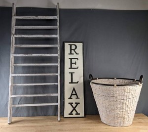 lot 112 image: Rustic Home Decor Items Ladders, RELAX Sign, and Wicker Basket B
