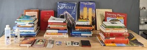 lot 124 image: Assortment of Books Self Help, Inspirational, Religious, and Others, 4 Bottles of Holy Water, Bookmarks, and More  B