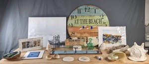 lot 100 image: Just Beachy Clock, Silver Dollars, Shells, Decorative Hangers, Artwork, & More B