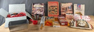 lot 101 image: Baking Supplies Cookie Cutters, Emeril Baking Pan, Better Homes Complete Book of Baking, Betty Crocker Cookbook, & More. B