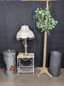 lot 140 image: Farmhouse Chic Galvanized Rooster Trash Can and Tall Bucket, Ornate Table Lamp, WoodMetal Side Table, Coat Rack, and Eucalyptus Wreath B