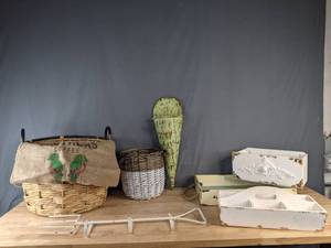 lot 144 image: Farmhouse Chic  Metal Wall Decor, Woven Baskets, Boxes and Trays, and Dunn Bros Coffee Bean Bag B