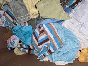 lot 29 image: Resellers Paradise 44 Tall Box of Pre-Owned Linens Towels Quilts Sheets Pillows B