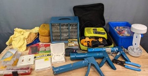 lot 247 image: RYOBI One Plus Charge Center, RYOBI Stud Finder, Hyde Tools 9 Caulk Gun, Mugger Adjustable Arm,  Bolts, 2 12  Finish Nails, Felt Pads and More S