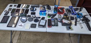 lot 82 image: Assorted Electronics - iPods, Phones (Samsung, HTC, etc), Remote Controls, HDMI Switch, Amazon Kindle, CablesChargers, and more H