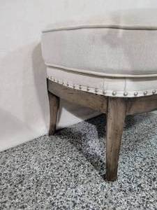 lot 9 image: Footstool Ottoman by Arhaus.