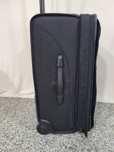 lot 16 image: Tumi Travel Suitcase.