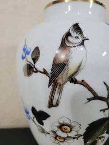 lot 21 image: Antique White Glass Vase with painted Bird and Flowers.