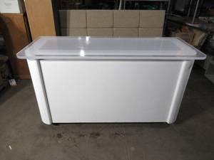 72x28x39.5 Rolling display counter.  Has 78 acrylic clear top with led lights underneath for display. On casters
