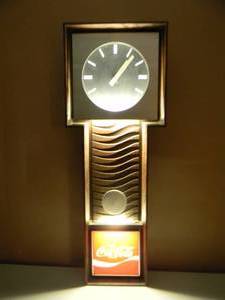 lot 24 image: VINTAGE ENJOY COCACOLA WALL CLOCK  LIGHT - Wood Look with Pendulum Vintage Benco -CLOCK & LIGHTS WORK - GREAT OLD SCHOOL PIECE - APPROX 33 By 12 - SEE PICTURES