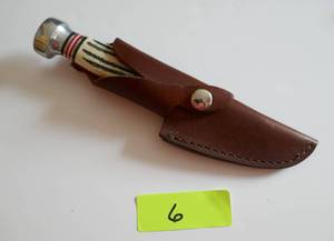 lot 6 image: New knife and sheath from North American Hunting Club, bone