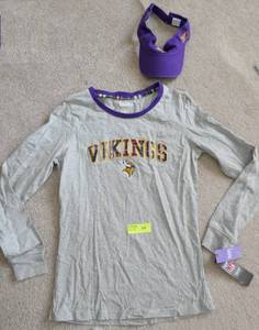 lot 132 image: Very cute Womens Vikings shirt with embroidered logos, and Visor, shirt is size Large but runs small