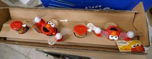 lot 171 image: Box of 12 Elmo light up toys, need new AA batteries