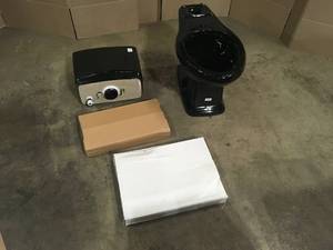 lot 8 image: Glacier Bay 2-piece 1.0 GPF1.28 GPF High Efficiency Dual Flush Elongated Toilet in Black, Seat Included, Customer return, Review all pictures
