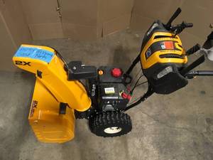 lot 28 image: Cub Cadet 2X 26 in. 243 cc Two-Stage Gas Snow Blower with Electric Start, Power Steering and Steel Chute, Customer return, Review all pictures