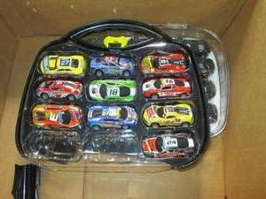 lot 87 image: 24-Pc. Racing Cars Case case is bro...