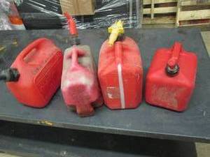 lot 311 image: 4 gas cans ...
