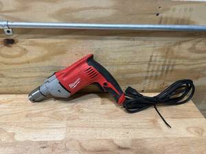 lot 59 image: MILWAUKEE 8 Amp Corded 12 in. Hammer Drill Driver