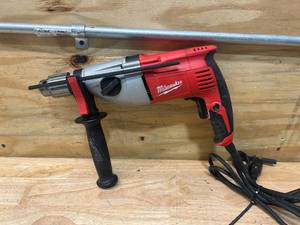 lot 62 image: MILWAUKEE 7.5 Amp Corded 12 in. Pistol Grip 2-Speed Hammer Drill