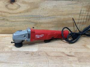 lot 66 image: MILWAUKEE 11 Amp Corded 4-12 in. Small Angle Grinder with Lock-On Paddle Switch