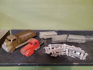 lot 134 image: Old Metal Trucks And Train With Tracks