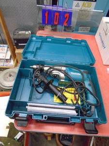 lot 102 image: Makita 12 dual speed impact hammerdrill with case. Looks new. Tested & works. As shown.