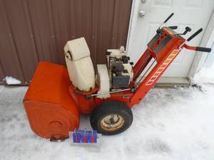 lot 122 image: Simplicity 8hp snow blower with electric start. Used condition. Tested & works. As shown.