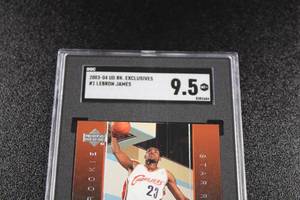 lot 161 image: 2003-04 Upper Deck Rookie Exclusives LeBron James #1 SGC 9.5 Rookie Card