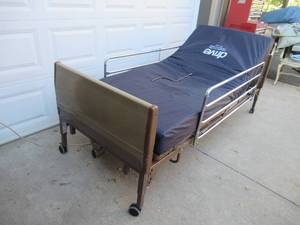 lot 4 image: Adjustable Power Twin Bed  Hospital Bed with new bedding. Invacare 5000.