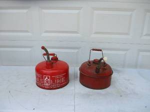 lot 77 image: 2- Red 2.5 gallon gas cans.