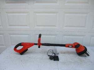 lot 84 image: Black & Decker electric Tiller with battery & charger