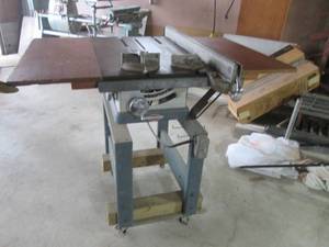 lot 2 image: Craftsman table saw with tilt on a ...