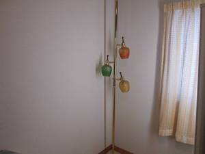 lot 64 image: Pole lamp with colored glass globes...