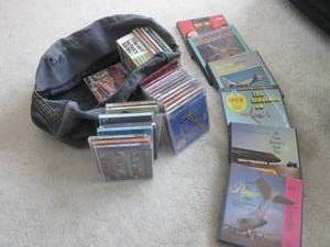 lot 93 image: Bag filled with CDs and reel to ree...