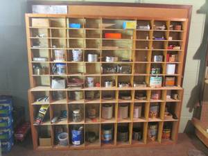 lot 102 image: Cubby holder filled with cans of ha...