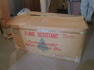 lot 122 image: 7 foot flame resistant Christmas tr...