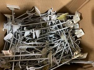 SMALL BOX OF METAL STORE HOOKS