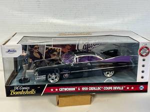 lot 53 image: Jada DC Comics Bombshell 1959 Catwomen Cadillac Coupe DeVille