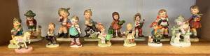 Shelf Full Of Misc. Antique Figurines