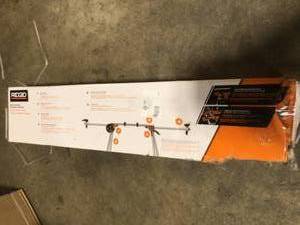 lot 16 image: RIDGID Professional Compact Miter Saw Stand Open Box, Customer returns, Review all pictures