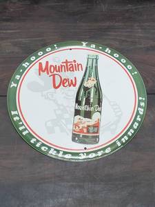lot 33 image: Vintage Metal Mountain Dew Sign