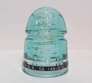 lot 13 image: H.B.R Light Aquamarine CD 145-010 Glass Insulator