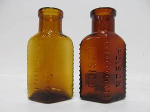 lot 23 image: 2 Antique Embossed Glass Poison Bottles