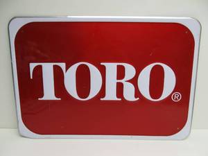 lot 39 image: Embossed Metal TORO Dealer Advertising Sign