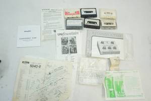 instruction papers, cassette music tapes