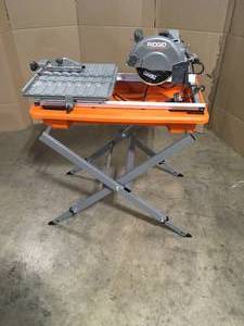 lot 16 image: RIDGID 9 Amp Corded 7 in. Wet Tile Saw with Stand, Open Box, Review all pictures