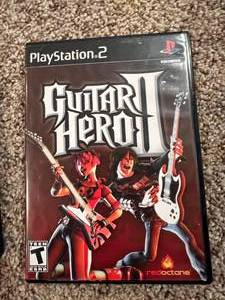 lot 19 image: Playstation 2 Game Lot DDR and Guitar Hero 2